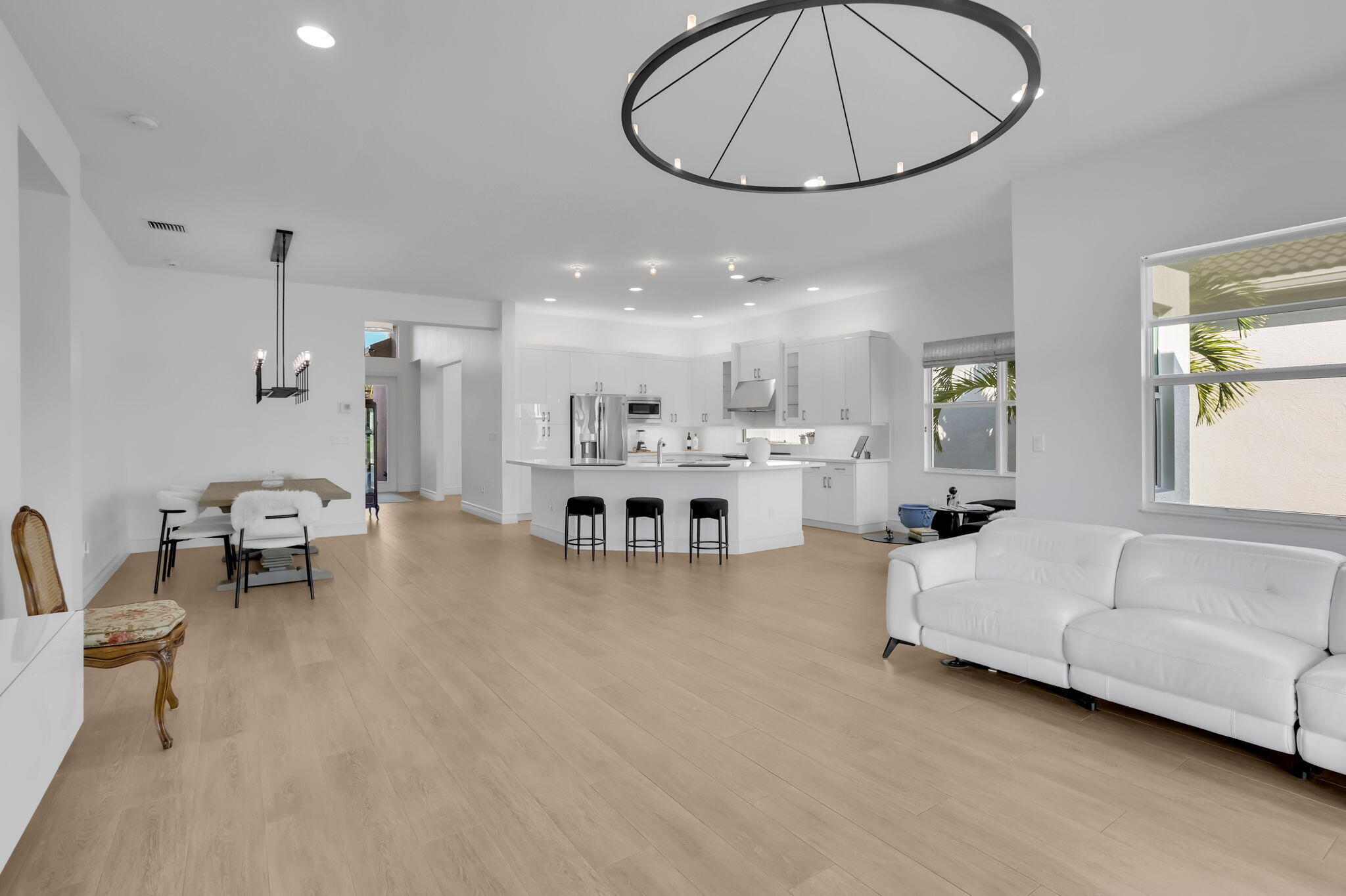 8254 Appalachian Ridge Road Boynton Beach, FL 33473 - Photo 14 of 50 a living room with furniture and a dining table
