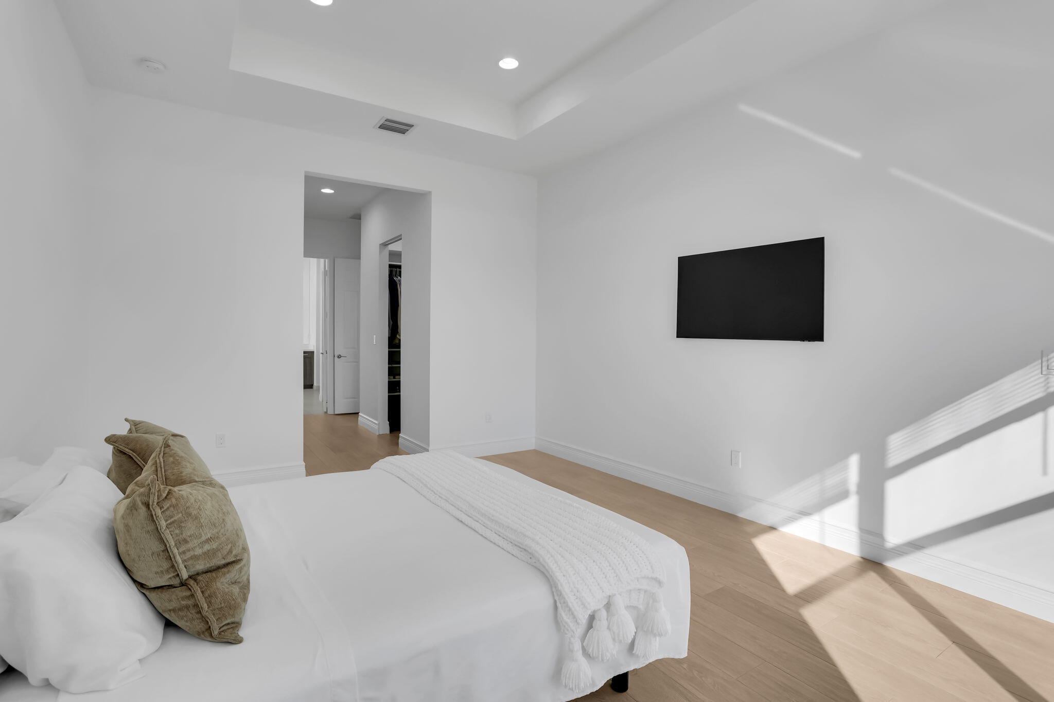 8254 Appalachian Ridge Road Boynton Beach, FL 33473 - Photo 18 of 50 a bedroom with a bed and a flat screen tv