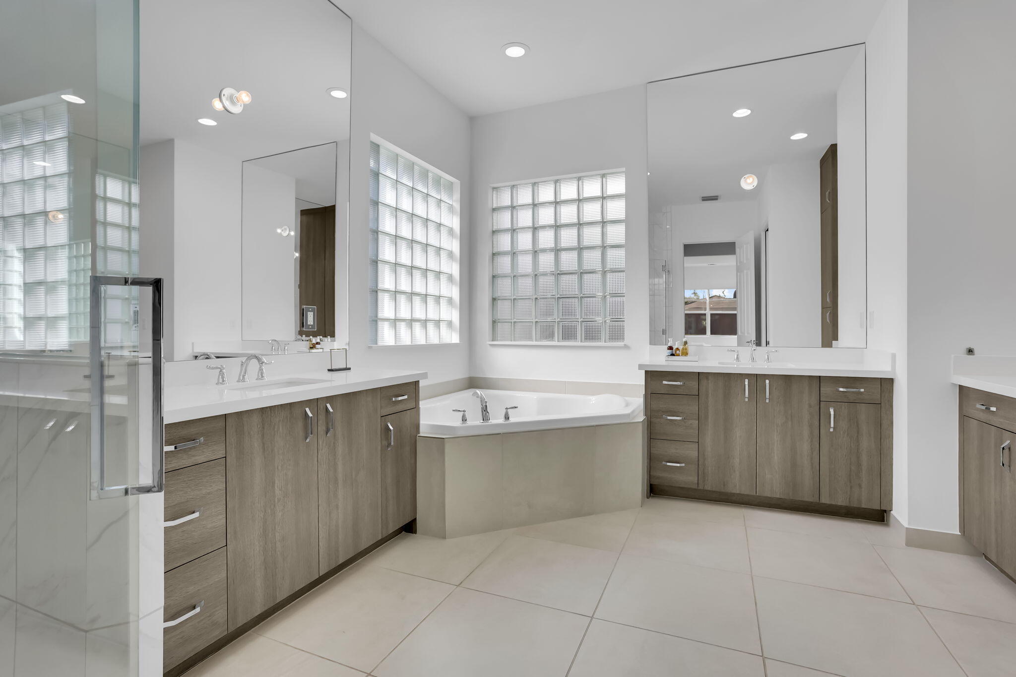 8254 Appalachian Ridge Road Boynton Beach, FL 33473 - Photo 19 of 50 a bathroom with a granite countertop sink mirror and a bathtub