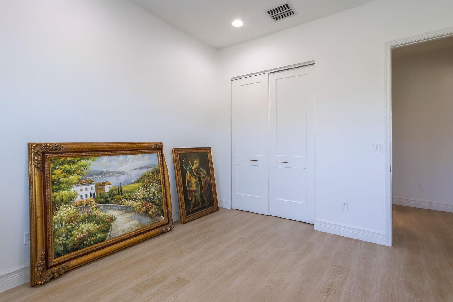 8254 Appalachian Ridge Road Boynton Beach, FL 33473 - Photo 24 of 50 a view of an empty room with painting on the wall