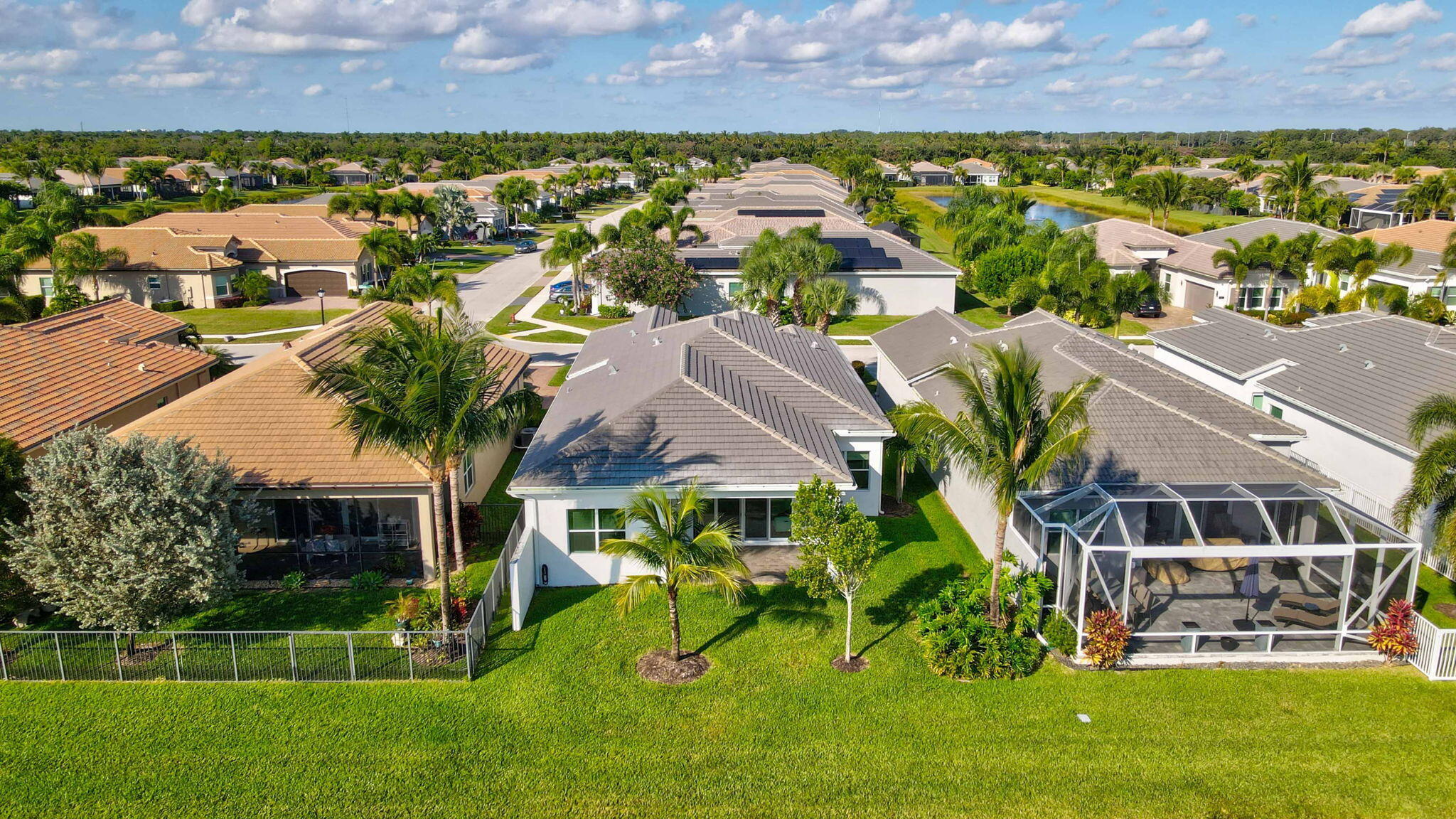 8254 Appalachian Ridge Road Boynton Beach, FL 33473 - Photo 35 of 50 an aerial view of a house with a garden and lake view