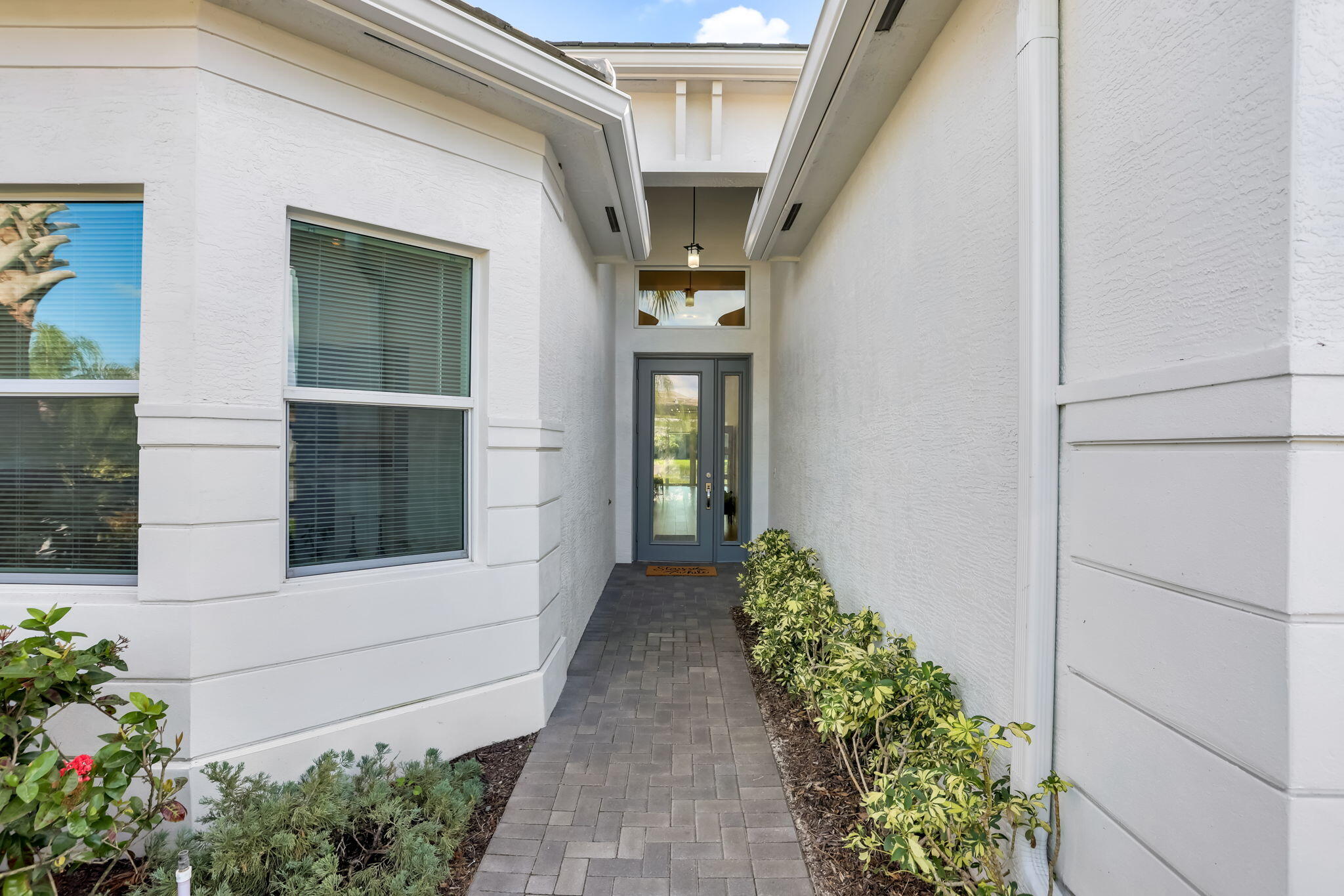 8254 Appalachian Ridge Road Boynton Beach, FL 33473 - Photo 4 of 50 a front view of a house with a yard