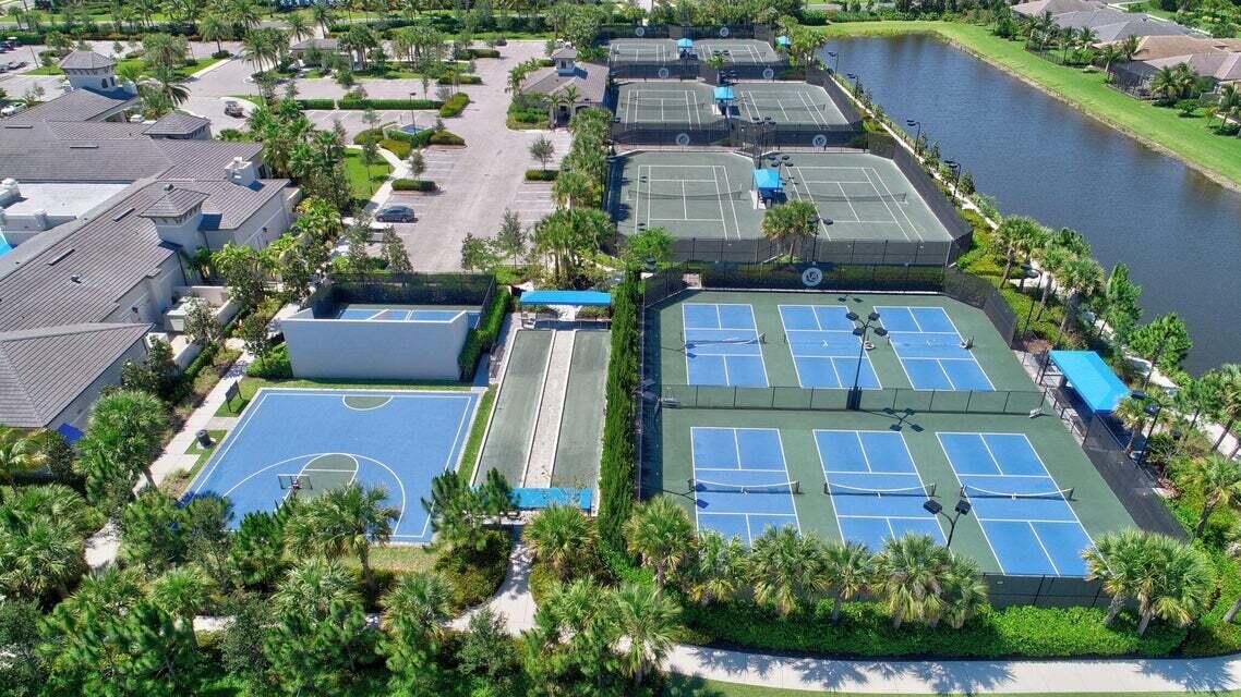 8254 Appalachian Ridge Road Boynton Beach, FL 33473 - Photo 42 of 50 an aerial view of a house with a garden