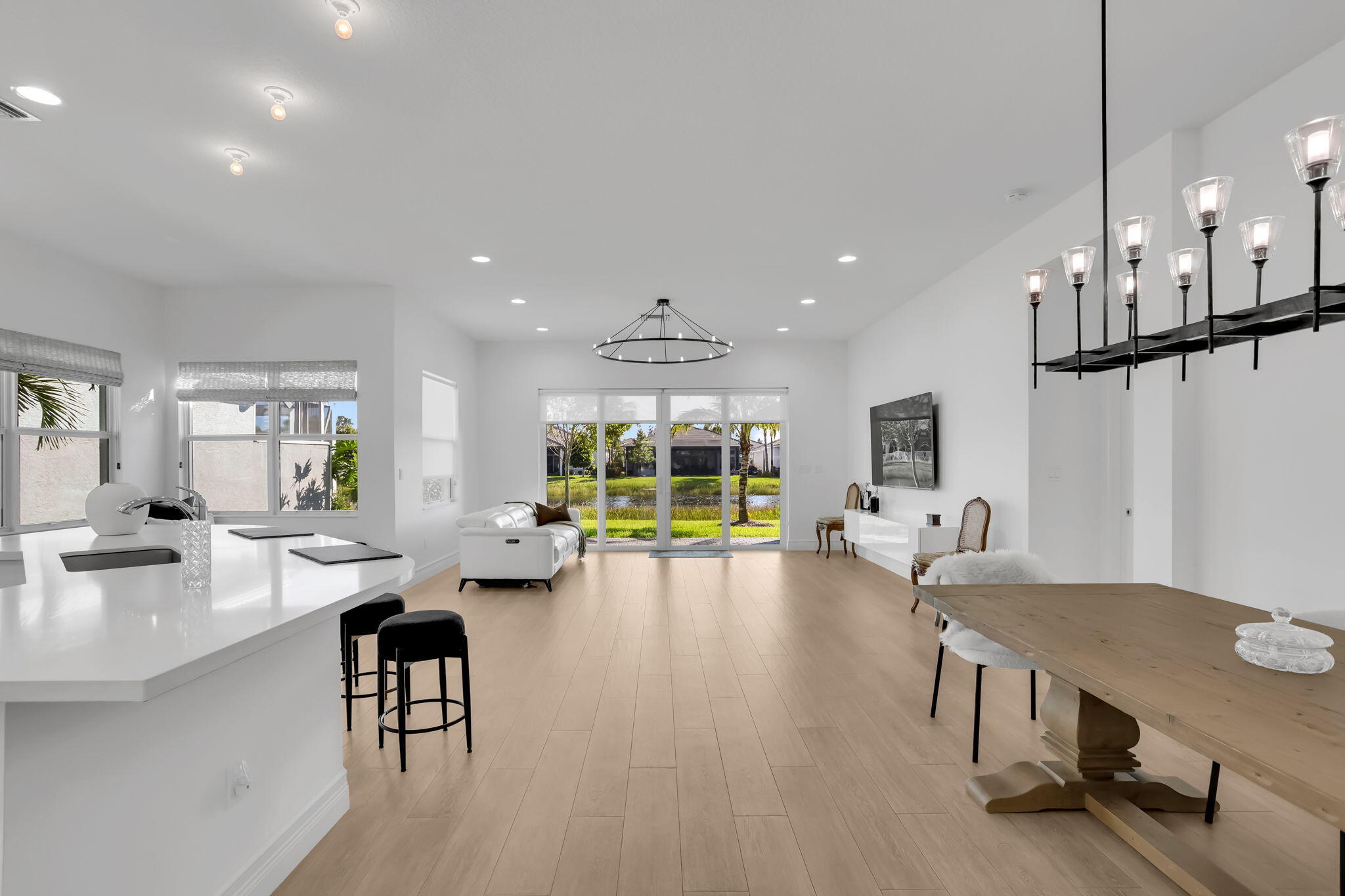 8254 Appalachian Ridge Road Boynton Beach, FL 33473 - Photo 6 of 50 a living room with furniture a table and a large window