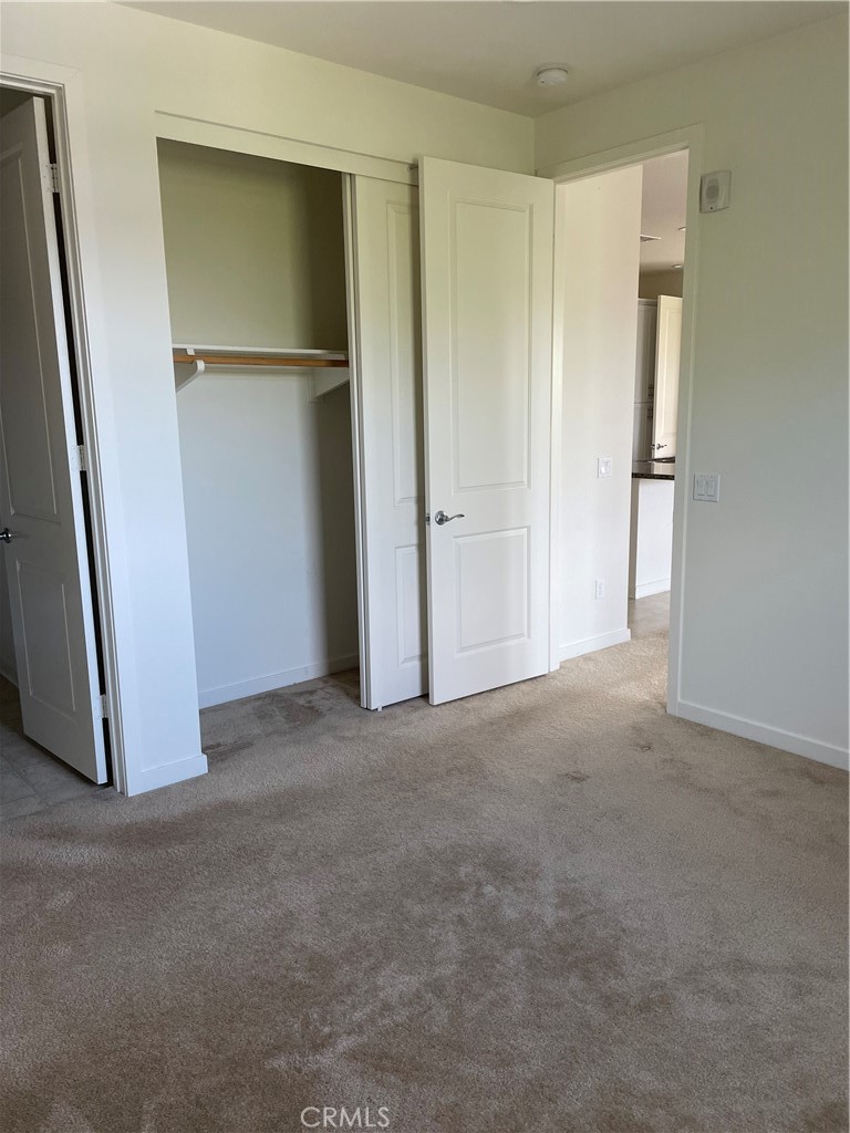 609 Trailblaze Irvine, CA 92618 - Photo 18 of 29 a view of a room with closet and wooden floor