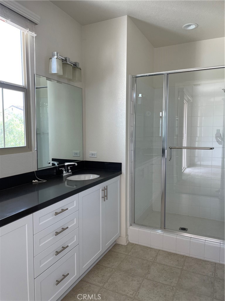 609 Trailblaze Irvine, CA 92618 - Photo 20 of 29 a bathroom with a granite countertop sink mirror and double