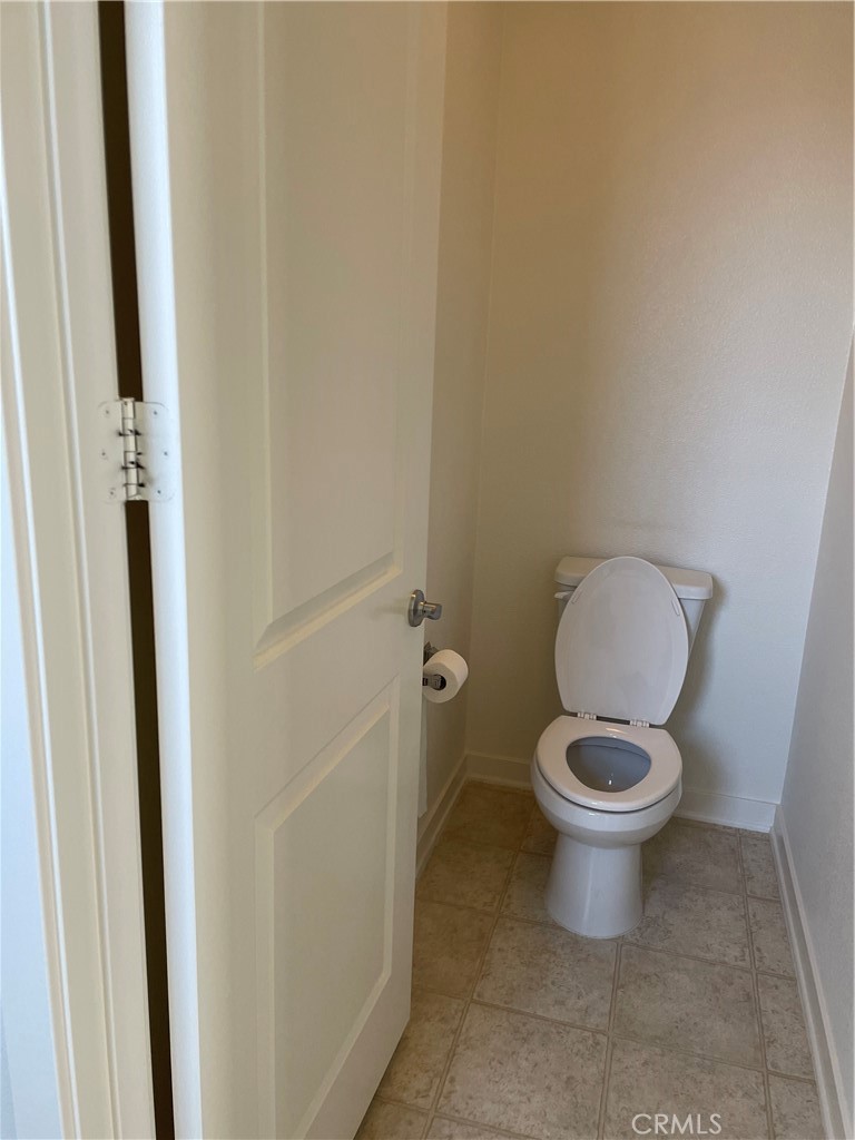 609 Trailblaze Irvine, CA 92618 - Photo 21 of 29 a white toilet sitting next to a sink