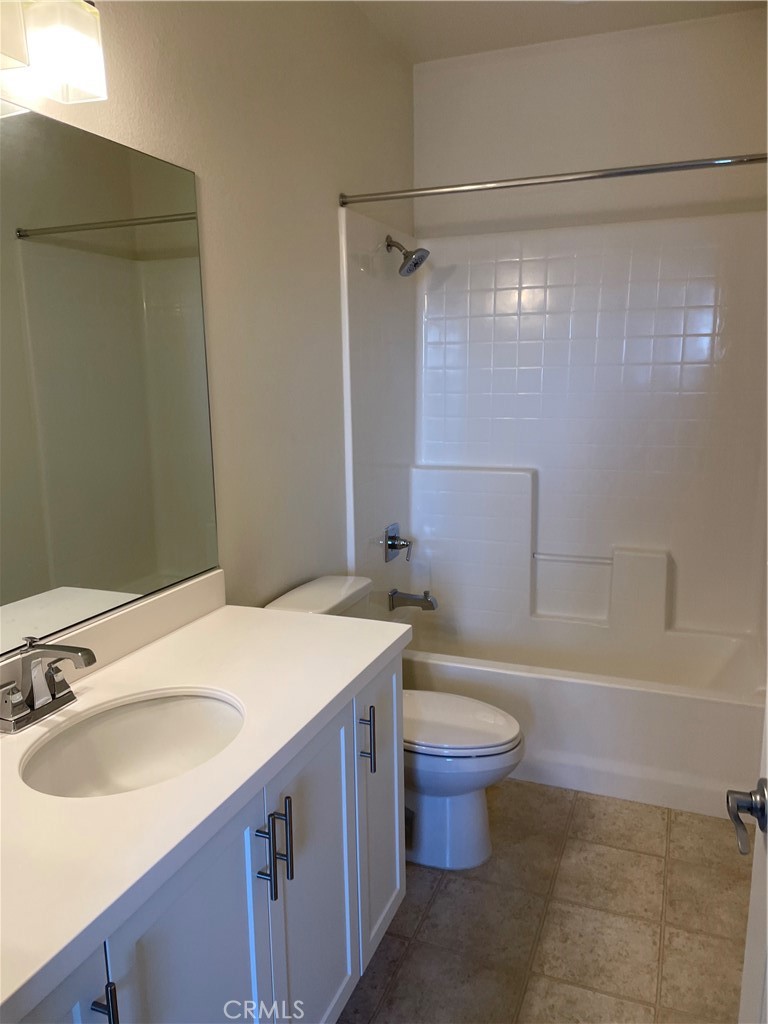 609 Trailblaze Irvine, CA 92618 - Photo 25 of 29 a bathroom with a sink toilet vanity and shower