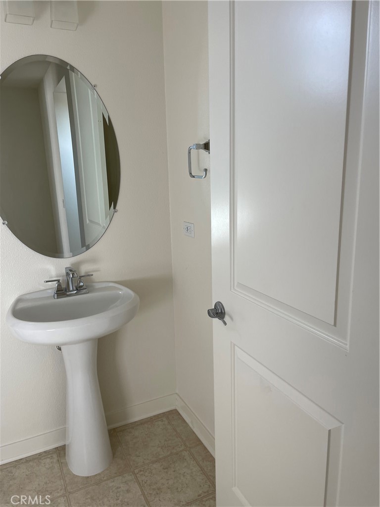 609 Trailblaze Irvine, CA 92618 - Photo 27 of 29 a bathroom with a sink and mirror