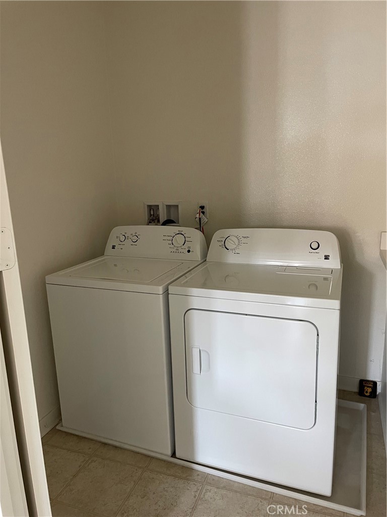609 Trailblaze Irvine, CA 92618 - Photo 29 of 29 a utility room with dryer and washer