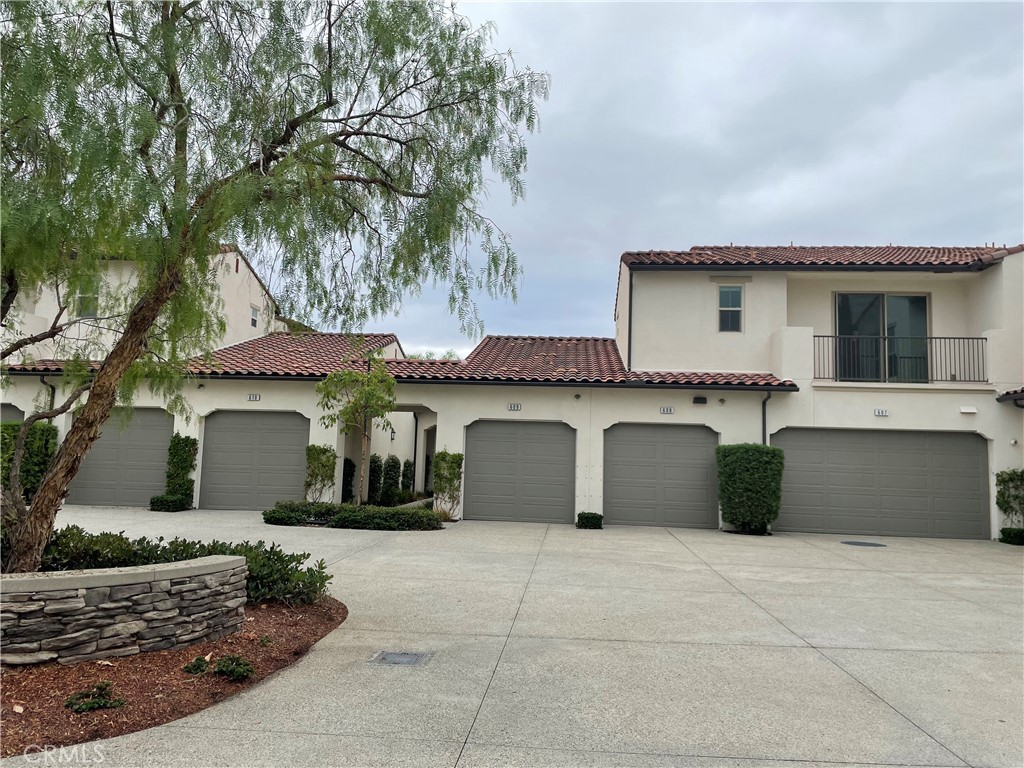 609 Trailblaze Irvine, CA 92618 - Photo 3 of 29 a front view of a house with a garage