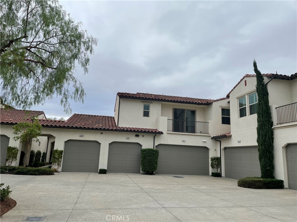 609 Trailblaze Irvine, CA 92618 - Photo 4 of 29 a front view of a house with garage