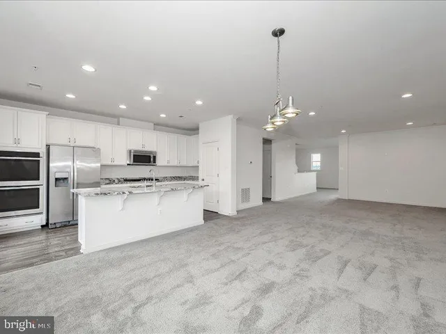 a view of a kitchen with electric appliances