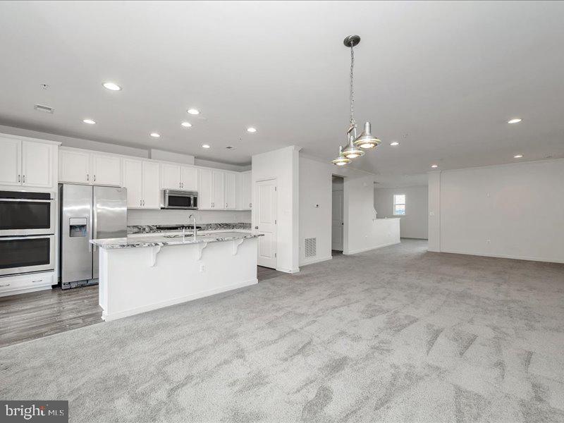 667 East Church Street, Unit B Frederick, MD 21701 - Photo 12 of 51 a view of a kitchen with electric appliances