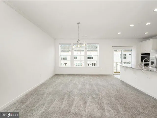 a view of a kitchen with furniture and chandelier
