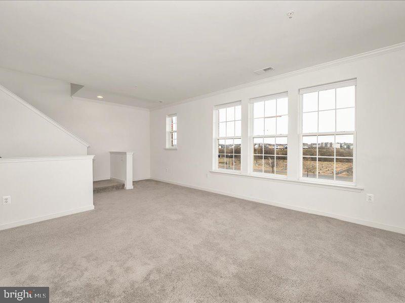 667 East Church Street, Unit B Frederick, MD 21701 - Photo 16 of 51 an empty room with windows