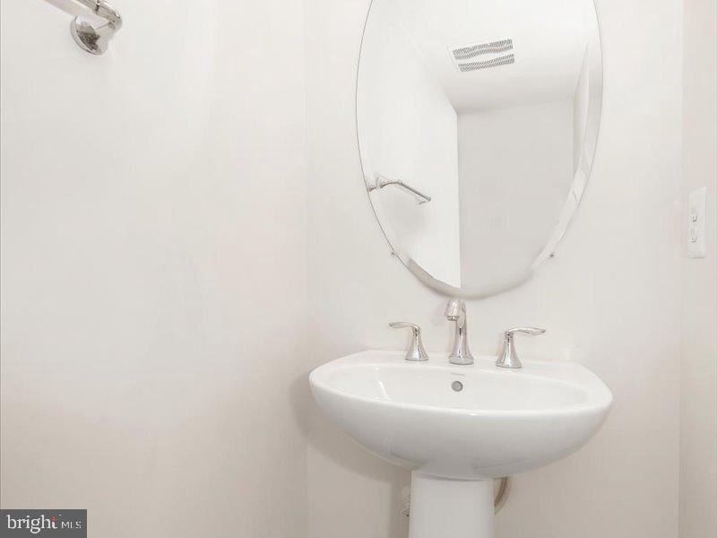 667 East Church Street, Unit B Frederick, MD 21701 - Photo 20 of 51 a sink with a mirror