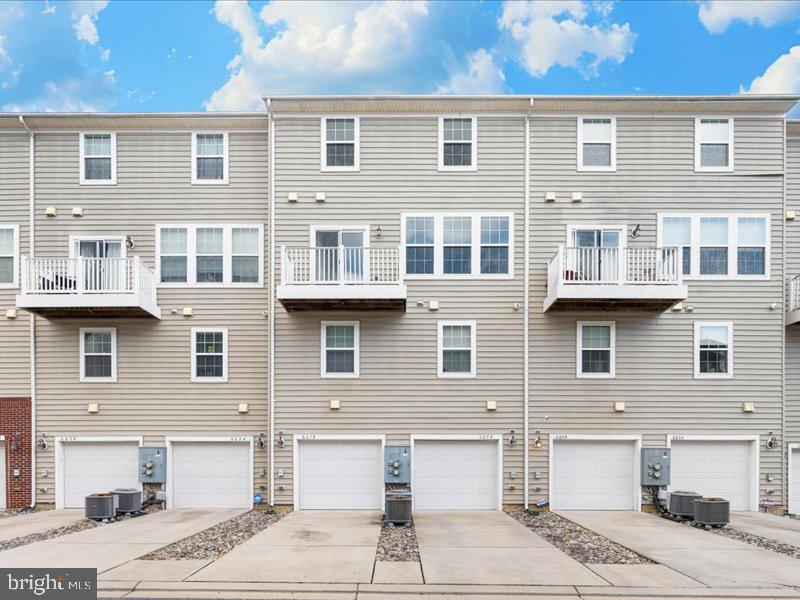 667 East Church Street, Unit B Frederick, MD 21701 - Photo 2 of 51 a front view of a house with a garden