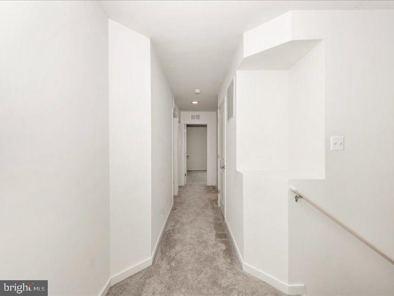 667 East Church Street, Unit B Frederick, MD 21701 - Photo 22 of 51 a view of a hallway with wooden floor