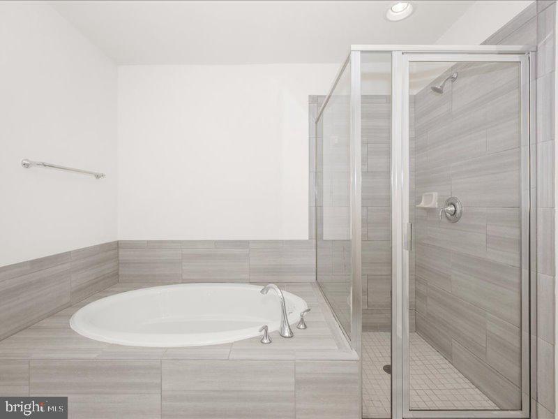 667 East Church Street, Unit B Frederick, MD 21701 - Photo 26 of 51 a bathroom with a bathtub