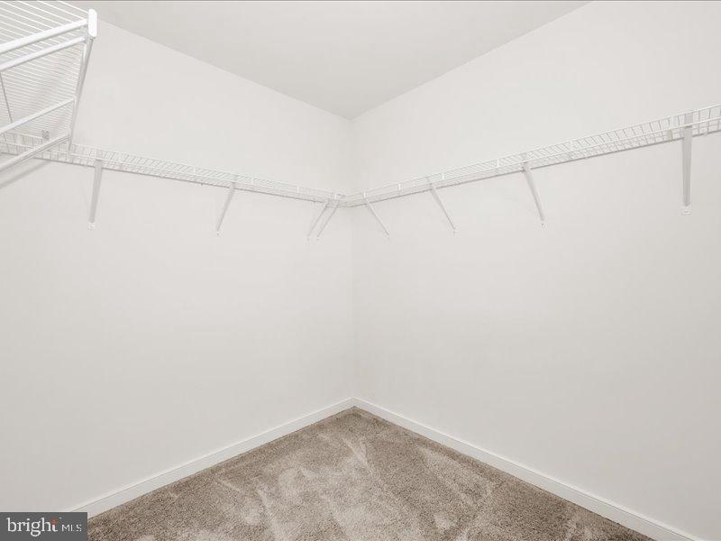 667 East Church Street, Unit B Frederick, MD 21701 - Photo 27 of 51 a view of a room with racks on the wall