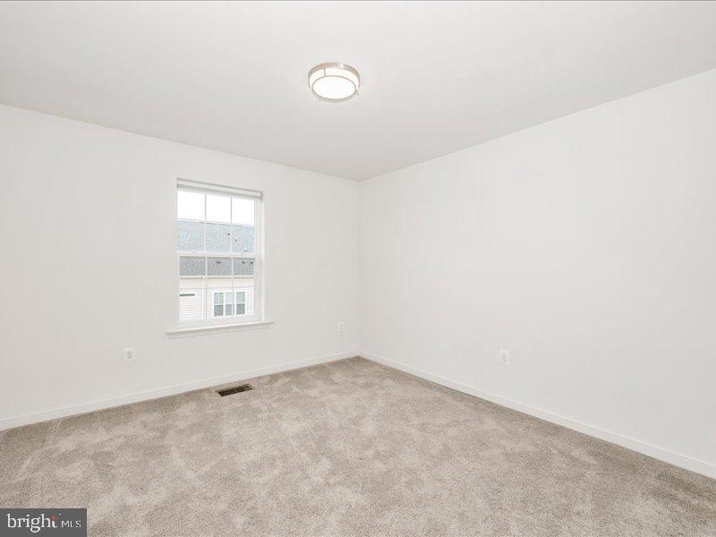 667 East Church Street, Unit B Frederick, MD 21701 - Photo 30 of 51 an empty room with a window