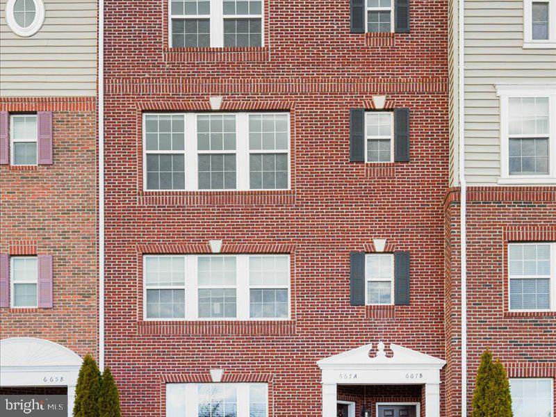 667 East Church Street, Unit B Frederick, MD 21701 - Photo 37 of 51 a front view of a building with a yard