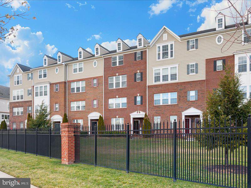 667 East Church Street, Unit B Frederick, MD 21701 - Photo 40 of 51 a front view of a house with a yard