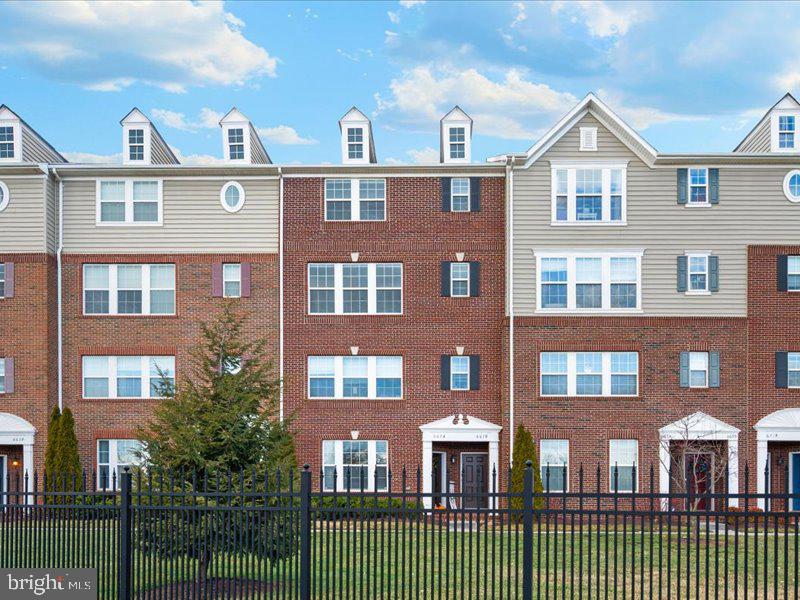 667 East Church Street, Unit B Frederick, MD 21701 - Photo 41 of 51 a view of a brick building next to a yard