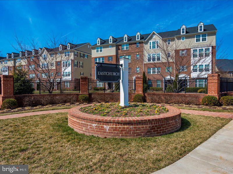 667 East Church Street, Unit B Frederick, MD 21701 - Photo 42 of 51 a tall brick building with glass windows and trees