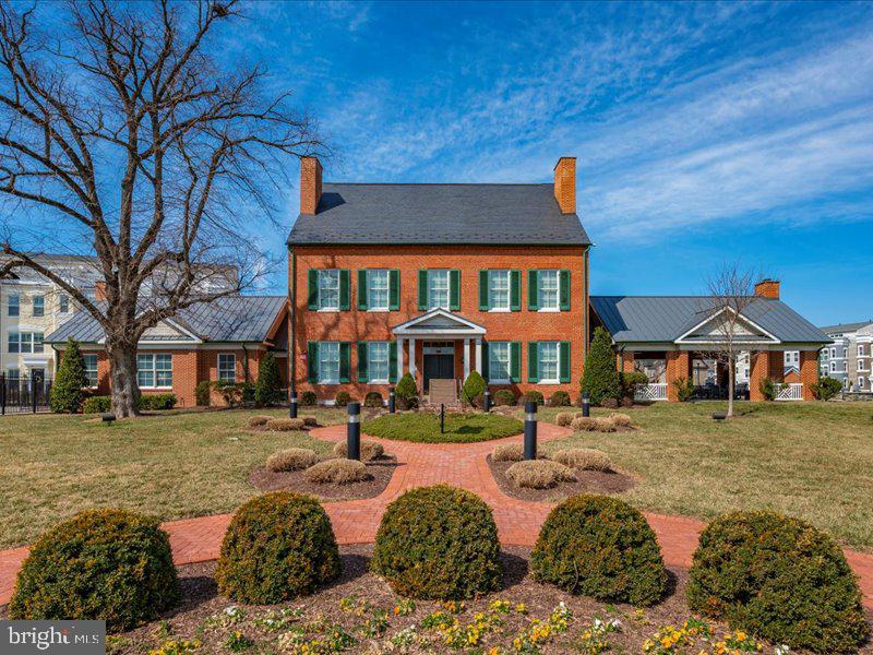 667 East Church Street, Unit B Frederick, MD 21701 - Photo 45 of 51 a front view of a house with a yard