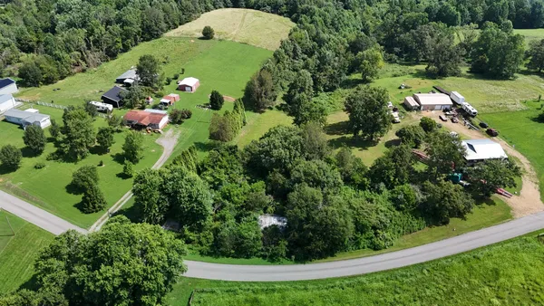 an aerial view of a residential houses with outdoor space
