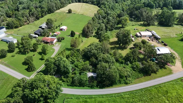 an aerial view of a residential houses with outdoor space