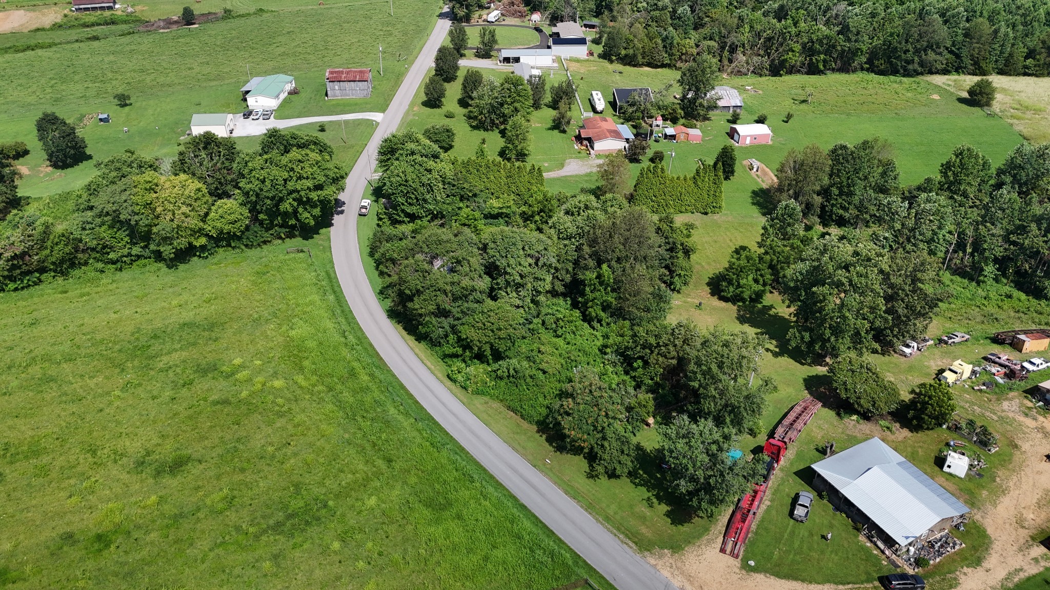 384 Underwood Road Lafayette, TN 37083 - Photo 7 of 8 an aerial view of residential houses with outdoor space and trees