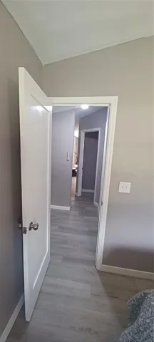 a kitchen with granite countertop a refrigerator and a sink