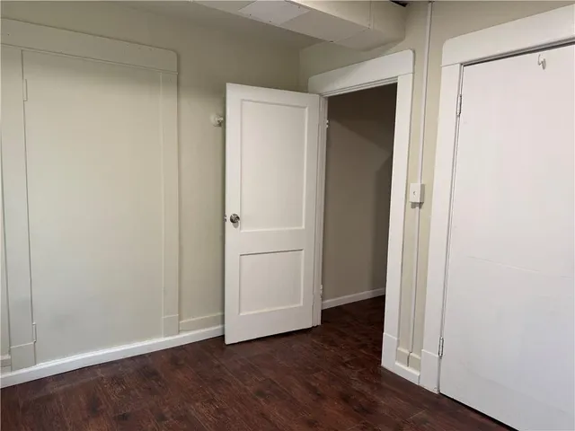 a bathroom with a sink mirror vanity and toilet