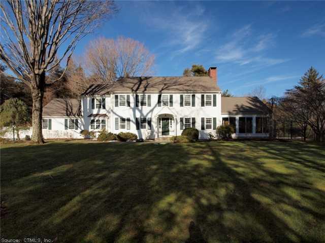 2550 Redding Road Fairfield, CT 06824 - Photo 1 of 1 a front view of a house with a garden