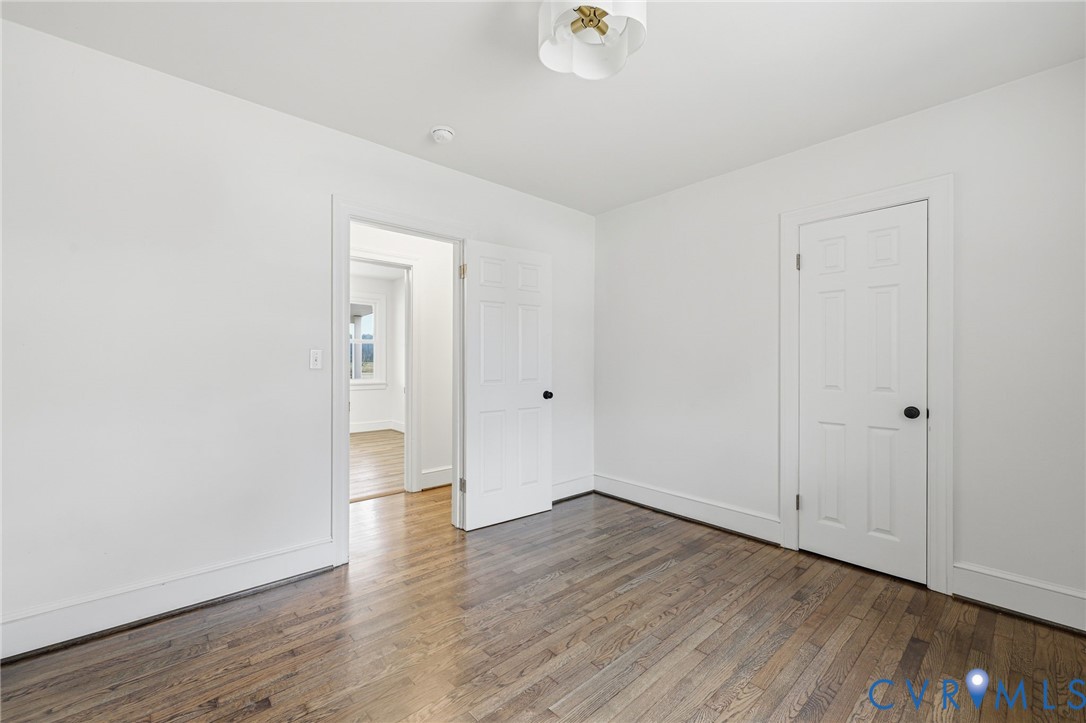 8202 Vaughan Road Petersburg, VA 23805 - Photo 16 of 31 a view of an empty room with wooden floor