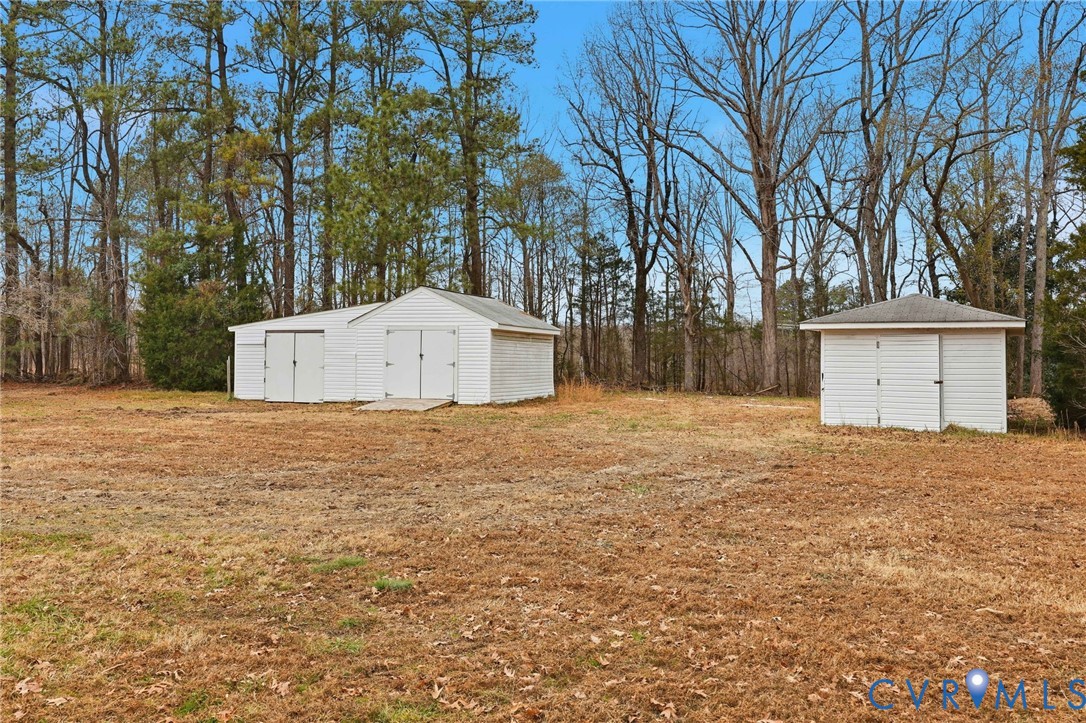 8202 Vaughan Road Petersburg, VA 23805 - Photo 29 of 31 a house with trees in front of it