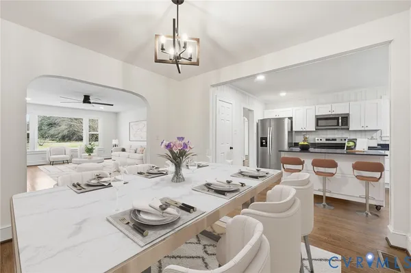 a view of kitchen with granite countertop cabinets and stainless steel appliances