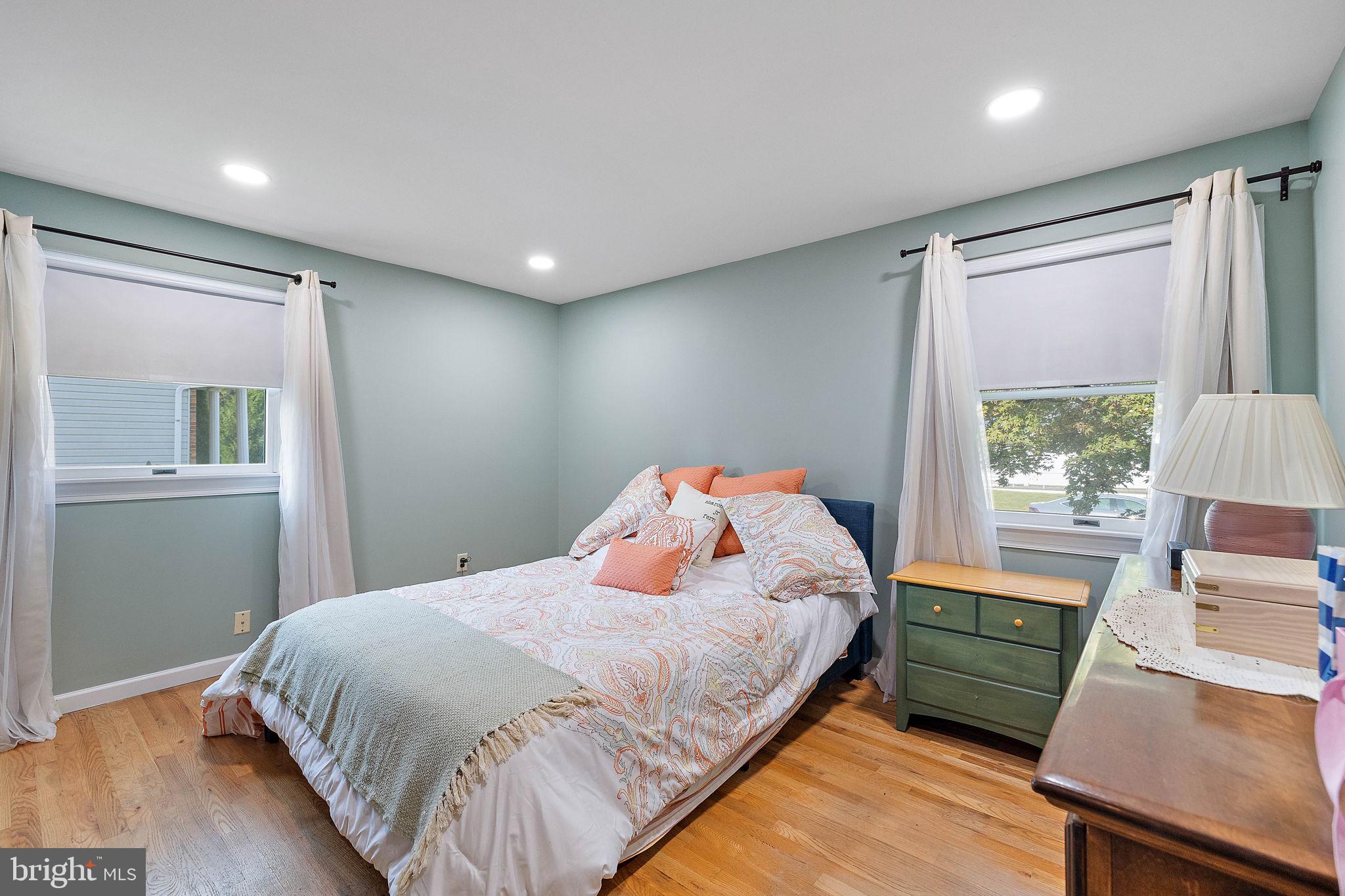 105 Eastfield Road Newark, DE 19713 - Photo 13 of 26 a bedroom with a bed and wooden floor