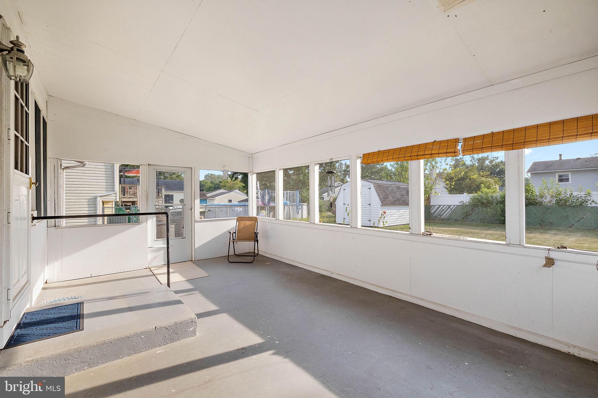 105 Eastfield Road Newark, DE 19713 - Photo 19 of 26 a living room with furniture and a large window