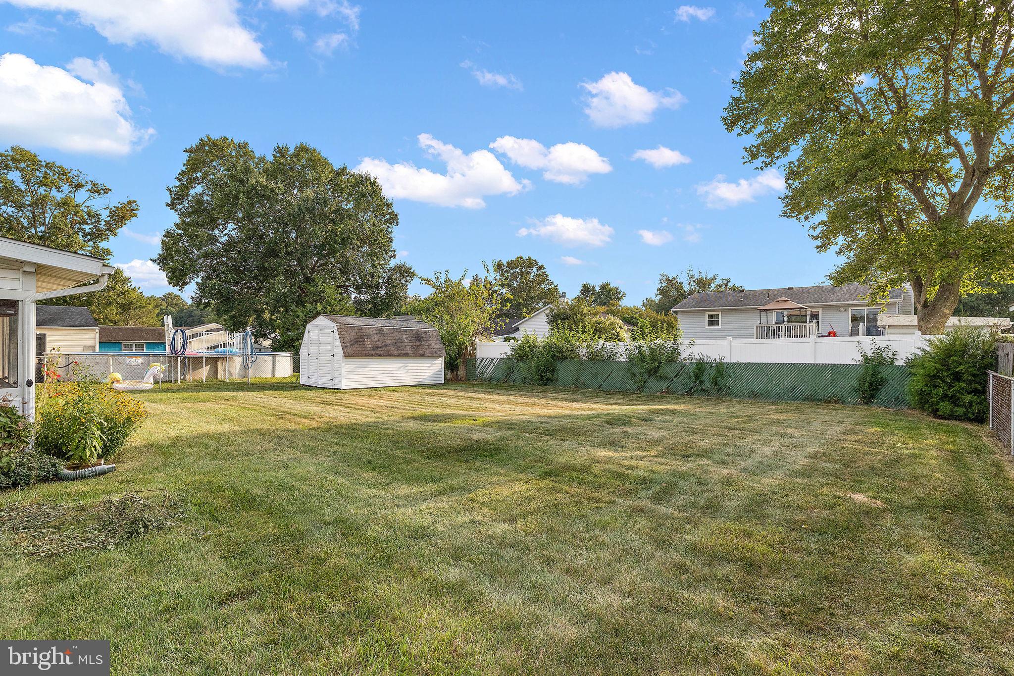 105 Eastfield Road Newark, DE 19713 - Photo 21 of 26 a front view of a house with a garden and trees