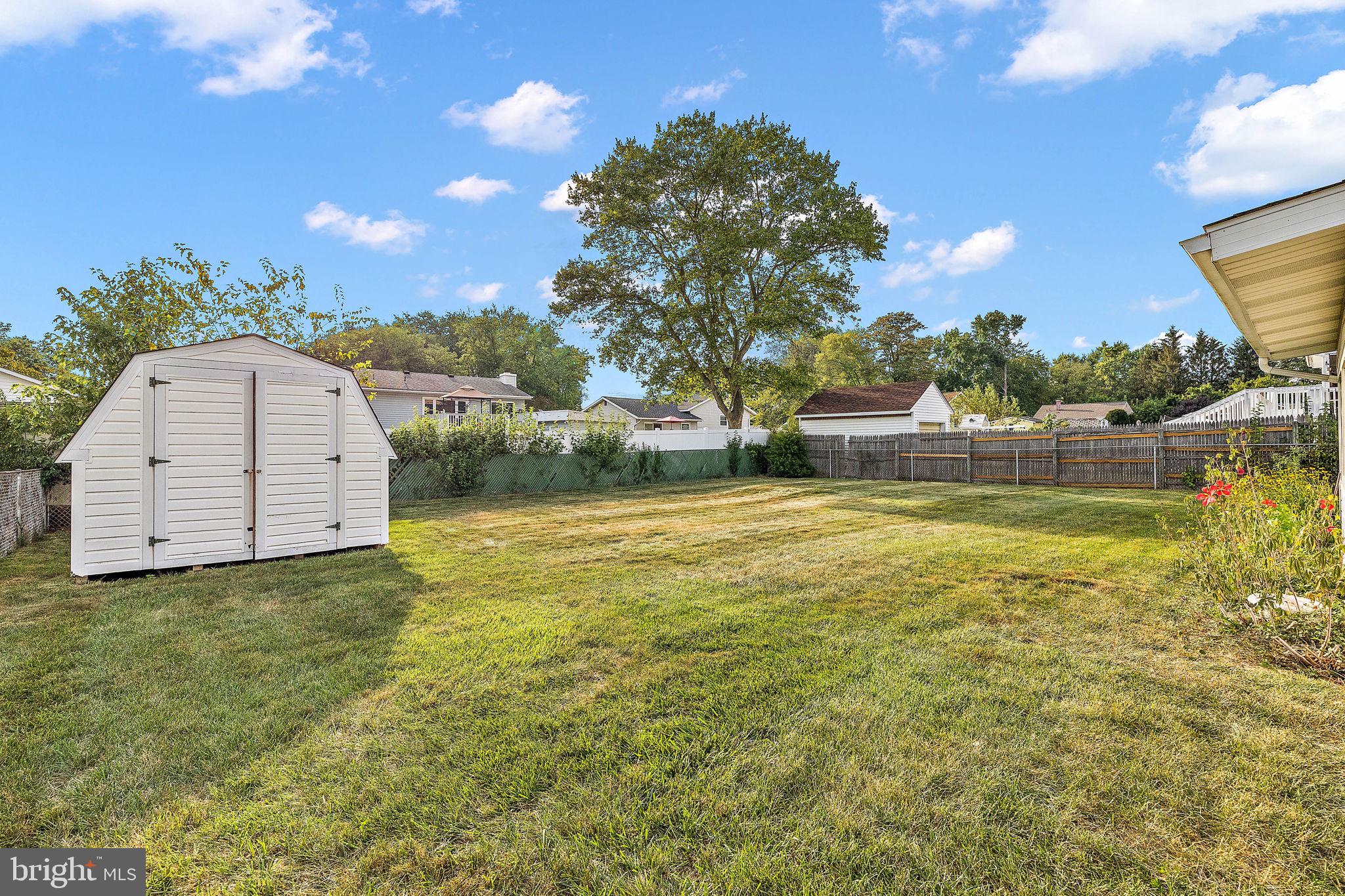 105 Eastfield Road Newark, DE 19713 - Photo 22 of 26 a view of a swimming pool with an outdoor space and seating area