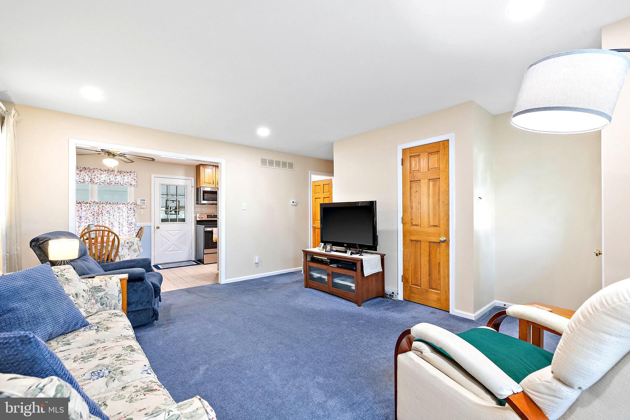105 Eastfield Road Newark, DE 19713 - Photo 3 of 26 a living room with furniture and a flat screen tv