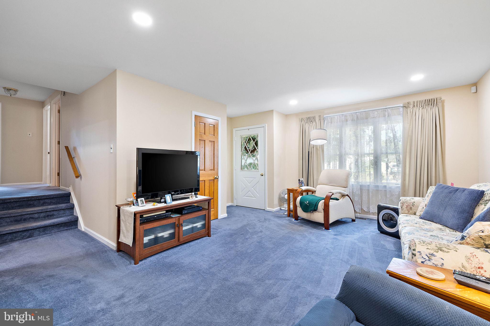 105 Eastfield Road Newark, DE 19713 - Photo 4 of 26 a living room with furniture and a flat screen tv