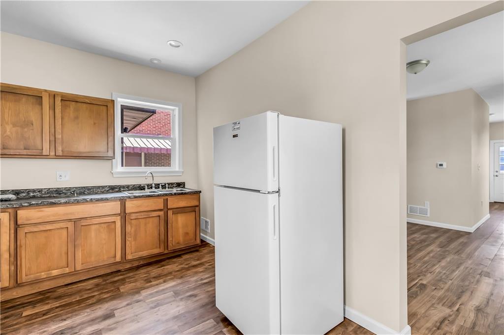522 Jefferson Street Rochester, PA 15074 - Photo 11 of 28 a white refrigerator freezer sitting inside of a kitchen