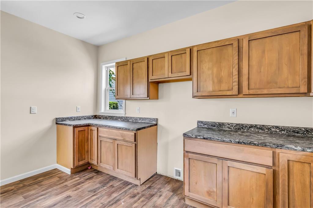 522 Jefferson Street Rochester, PA 15074 - Photo 12 of 28 a kitchen with stainless steel appliances granite countertop a stove and a sink
