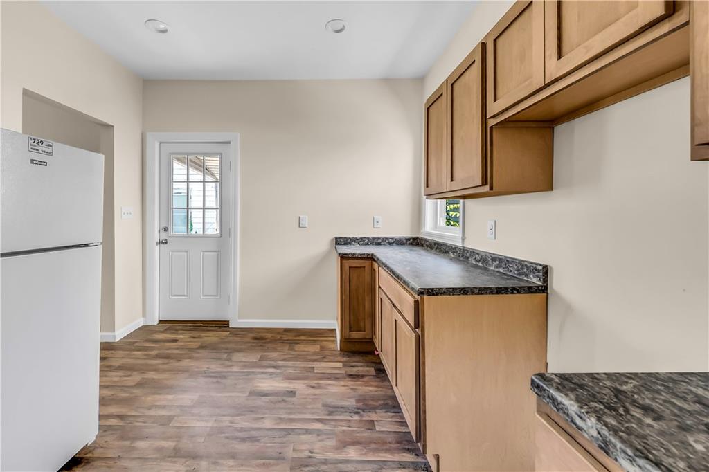 522 Jefferson Street Rochester, PA 15074 - Photo 15 of 28 a kitchen with granite countertop a sink and a stove