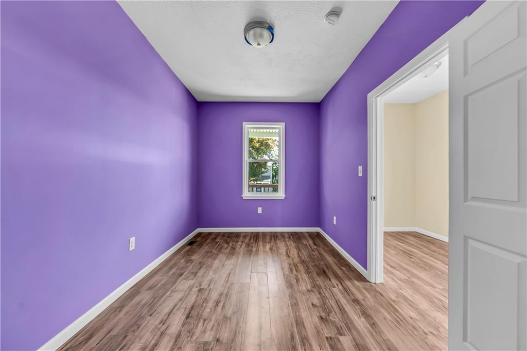 522 Jefferson Street Rochester, PA 15074 - Photo 16 of 28 a view of a room with wooden floor and windows